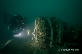 Diver illuminating the engine of the Wildcat JV571 © Bob Anderson courtesy of www.crashsiteorkney.com